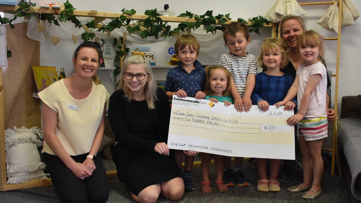 Cowra Commonwealth Bank's Stacey Smith and Sophie Wardle present Arthur Johnstone, Bonni Gundersen, Logan Thompson, Flossie Johnstone, Penny Smith and Mia Hattenfels with the $500 donation.