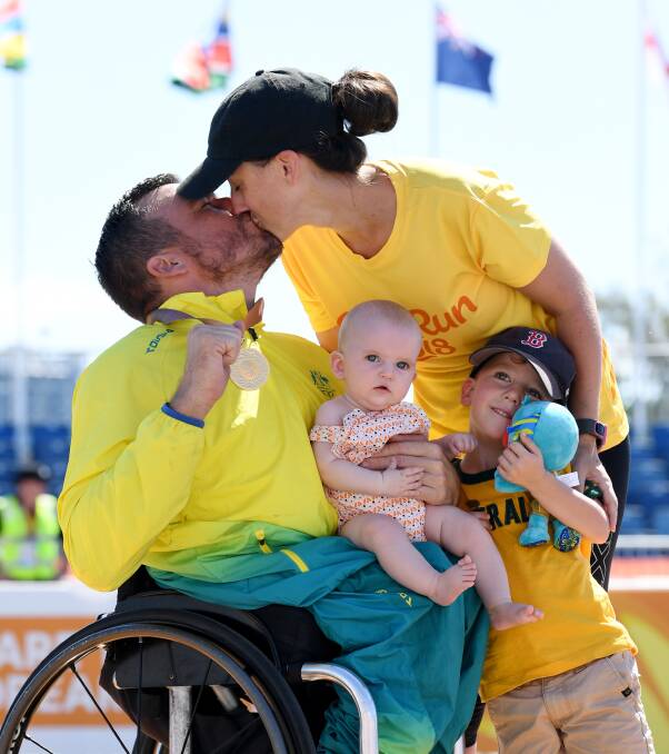 Winner: Kurt Fearnley, wife Sheridan and children Harry and Emilia after Fearnley's Commonwealth Games marathon victory. 