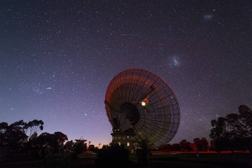 Eye on the sky: The Parkes Telescope in action is an amazing thing to witness, as are the heavenly bodies it keeps watch over. Photo: CSIRO.