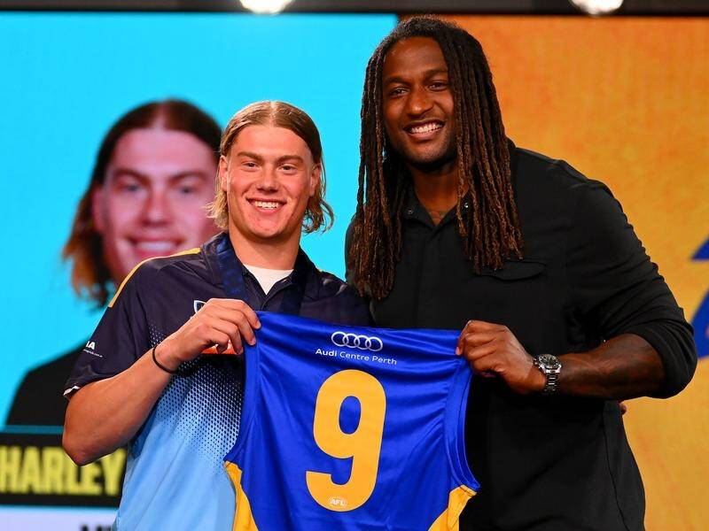 Harley Reid received a West Coast jumper from club legend Nic Naitanui as the AFL''s top draft pick. (Morgan Hancock/AAP PHOTOS)
