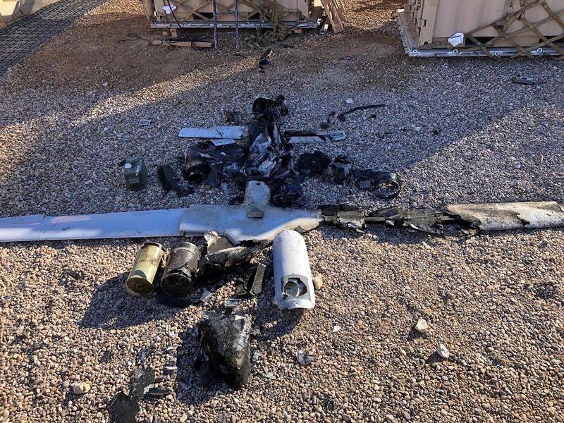 Iraq's air defences have shot down armed drones as they neared an air base which hosts US forces.