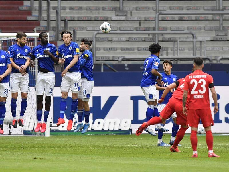 Eduard Loewen (2-R) nets Augsburg's opener with a fine free-kick in the win over Schalke.