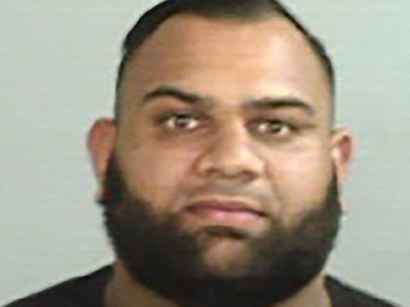 Alleged gang member Masood Zakaria was arrested when he landed in Darwin on Sunday afternoon. (HANDOUT/NSW POLICE)