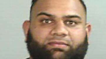 Alleged gang member Masood Zakaria was arrested when he landed in Darwin on Sunday afternoon. (HANDOUT/NSW POLICE)