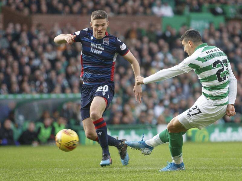Celtic's Mohamed Elyounoussi (r) scores his side's first goal against Ross County.