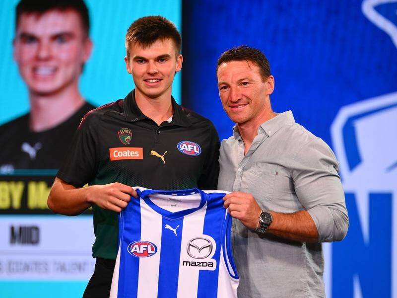North Melbourne great Brent Harvey (R) welcomed No.2 pick Colby McKercher to the famous AFL club. (Morgan Hancock/AAP PHOTOS)