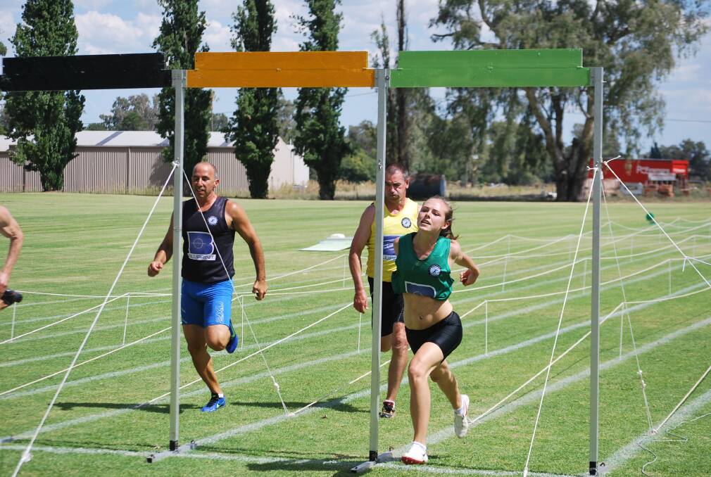 Gabriella Rhodes (right), pictured lunging for the finish in the Novice And Veterans (120m) race last year, will join Brooke White as Cowra's interests in this year's women's gift.