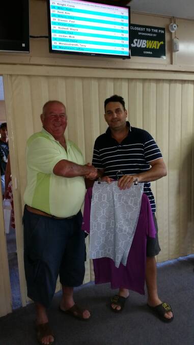 Geoff Curtale receiving his prize from Ross Chivers after his monthly A Grade medal win.