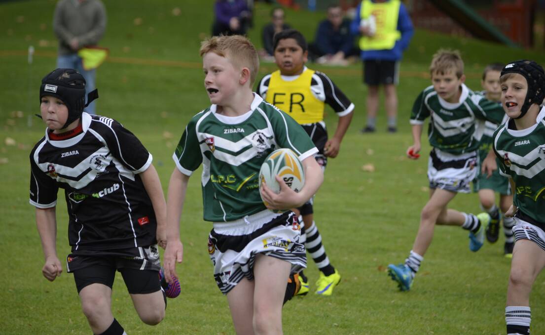 Stanley Rush makes a break in the under 10s junior rugby league competition.