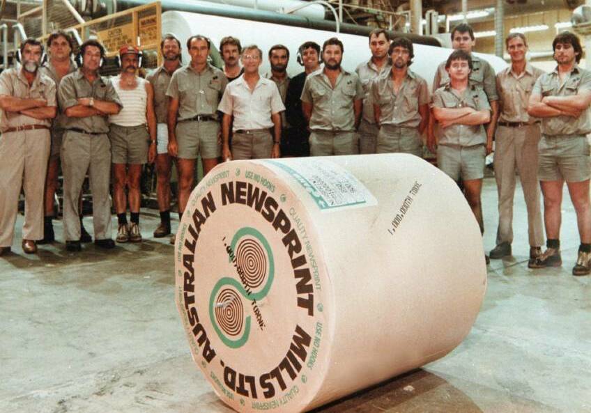 SPECIAL ROLL: Workers with the one millionth tonne of newsprint to come off the production line at the Ettamogah factory, just north of Albury. Picture: THE BORDER MAIL