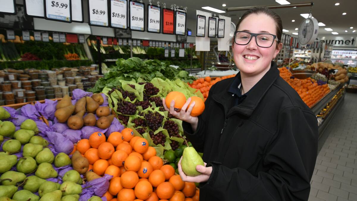 WORKING HARD: Shardai McNeill is one of almost 4000 people in Bathurst who work multiple jobs. One of her jobs is in Country Fruit. Photo: CHRIS SEABROOK 081319cjobs1