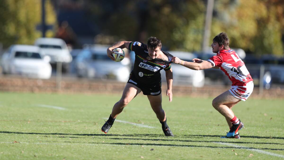 ACTION: Bathurst Panthers clash with Mudgee Dragons in a fiery match.