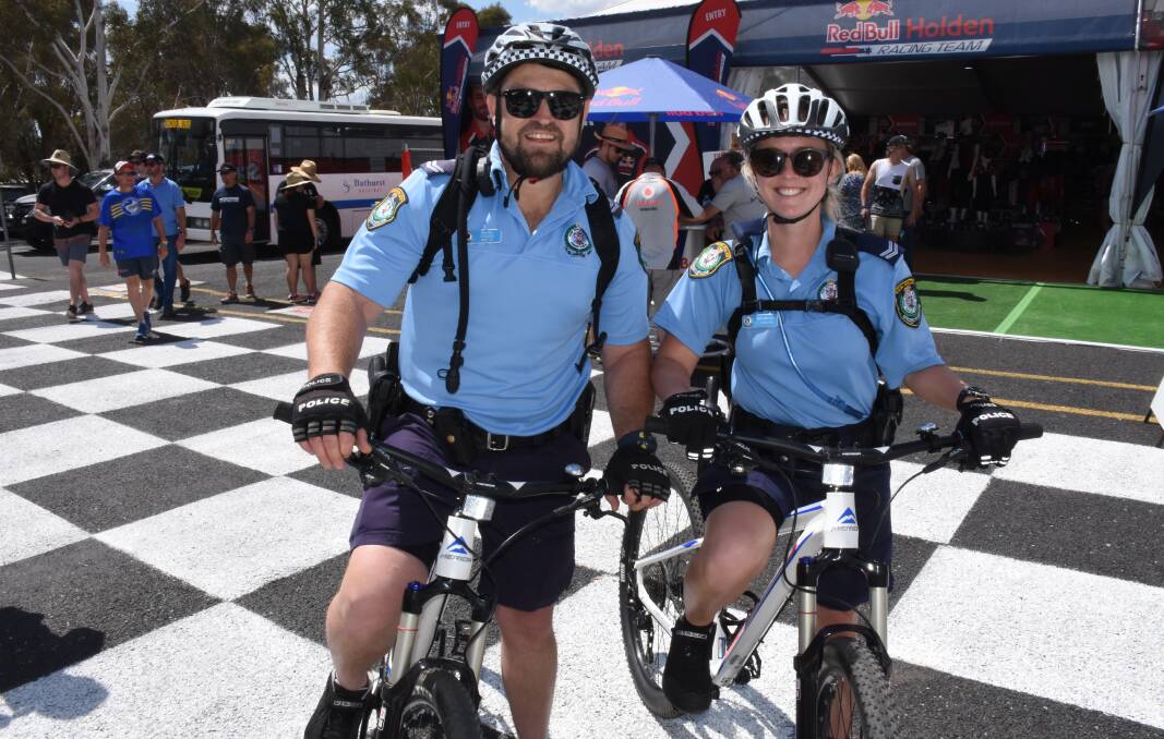 OUT IN FORCE: Tamworth Police Craig Thomas and Teghan Howard are among the hundreds of officers who have been called in to work at the Bathurst 1000. Photo: NADINE MORTON 100517nmfaces4