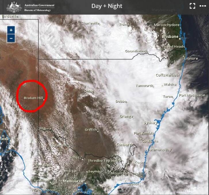 The dust storm is visible from space in the far west - appearing in the red circle near Broken Hill. Image: BUREAU OF METEOROLOGY