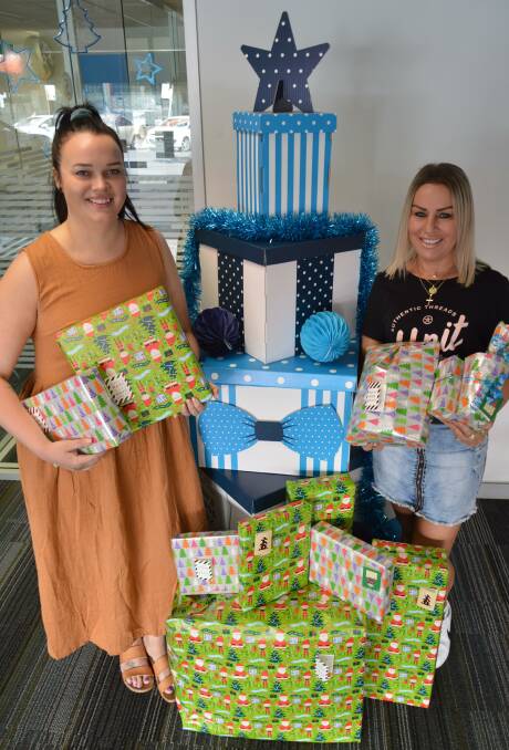 TIME FOR GIVING: Parkes women Jasmyne Symington and Belinda Doorey are on a mission to bring a little light, love and Christmas joy to the children in the Central West who are living in out-of-home care. Photo: Christine Little