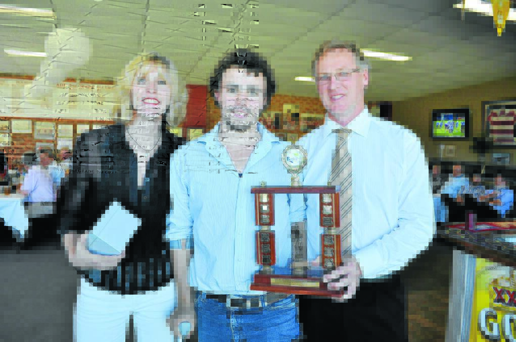 Sandra and Peter Russell present Daniel Wright with the Drew Russell Memorial Award for Colts Best and Fairest player.