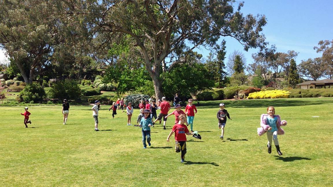Kids in PCYC School Holiday Care stretch their legs at the Japanese Gardens.