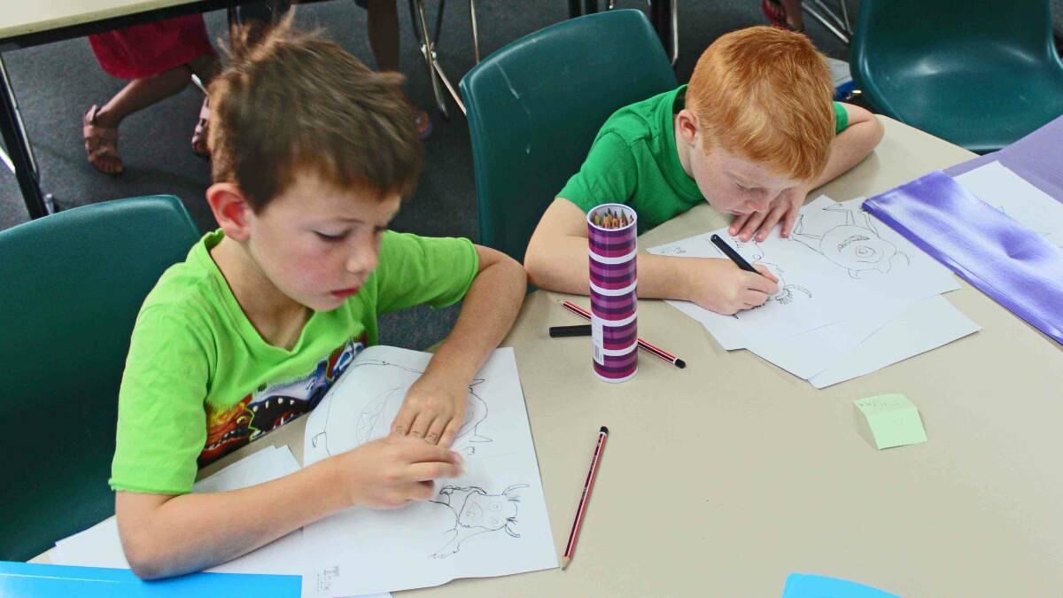 Lucas Ryan, 6, and Flynn Jones, 6, working hard on their artworks.