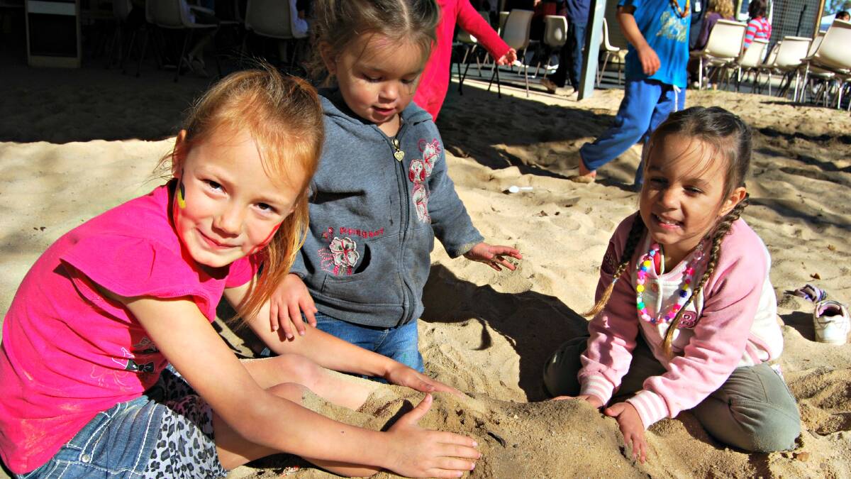 Luwana Newton takes the opportunity to build a sandcastle with cousins Navaeh and Tahlia Newton. 